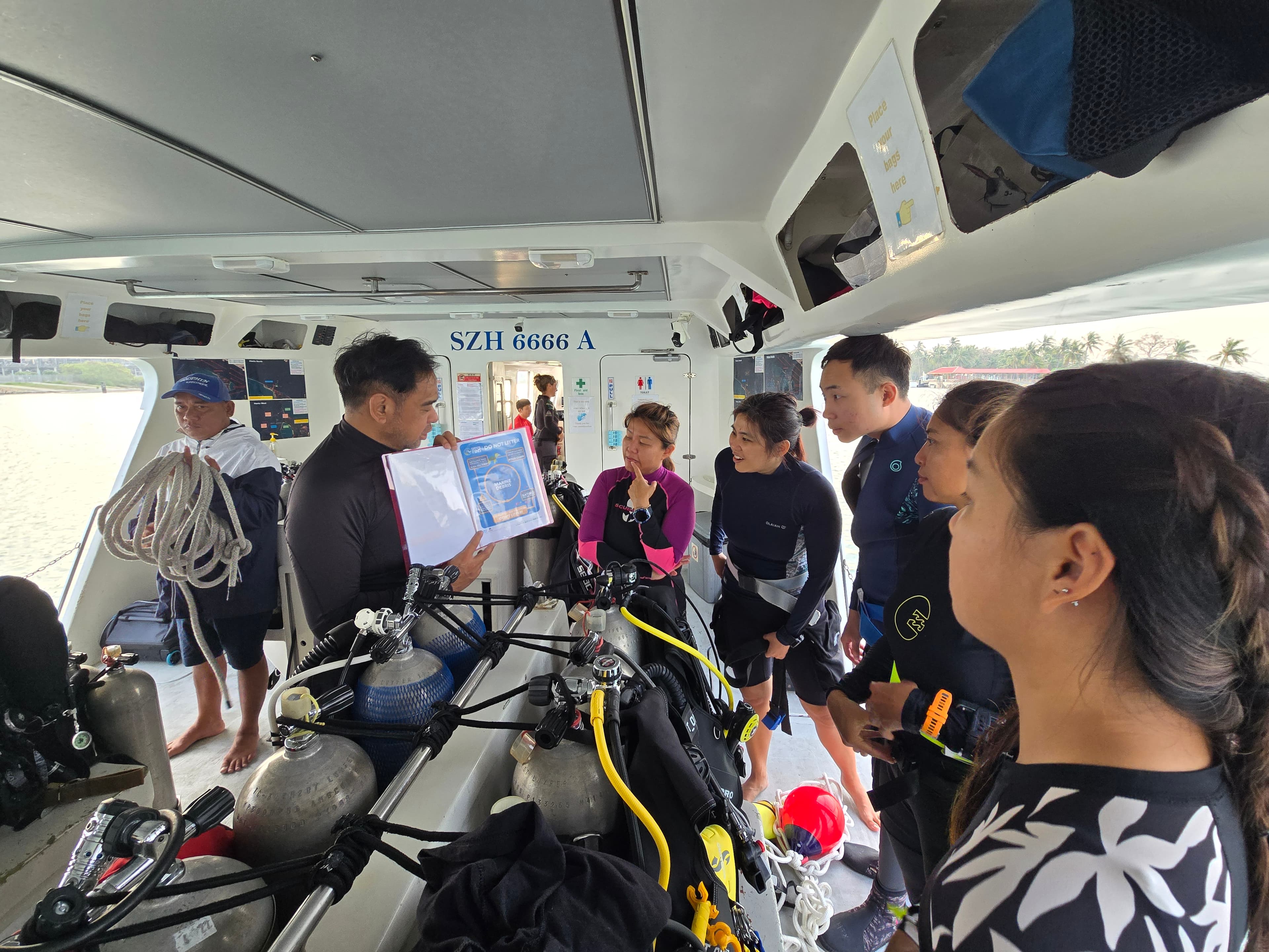 IDC candidate leading a dive briefing on the boat