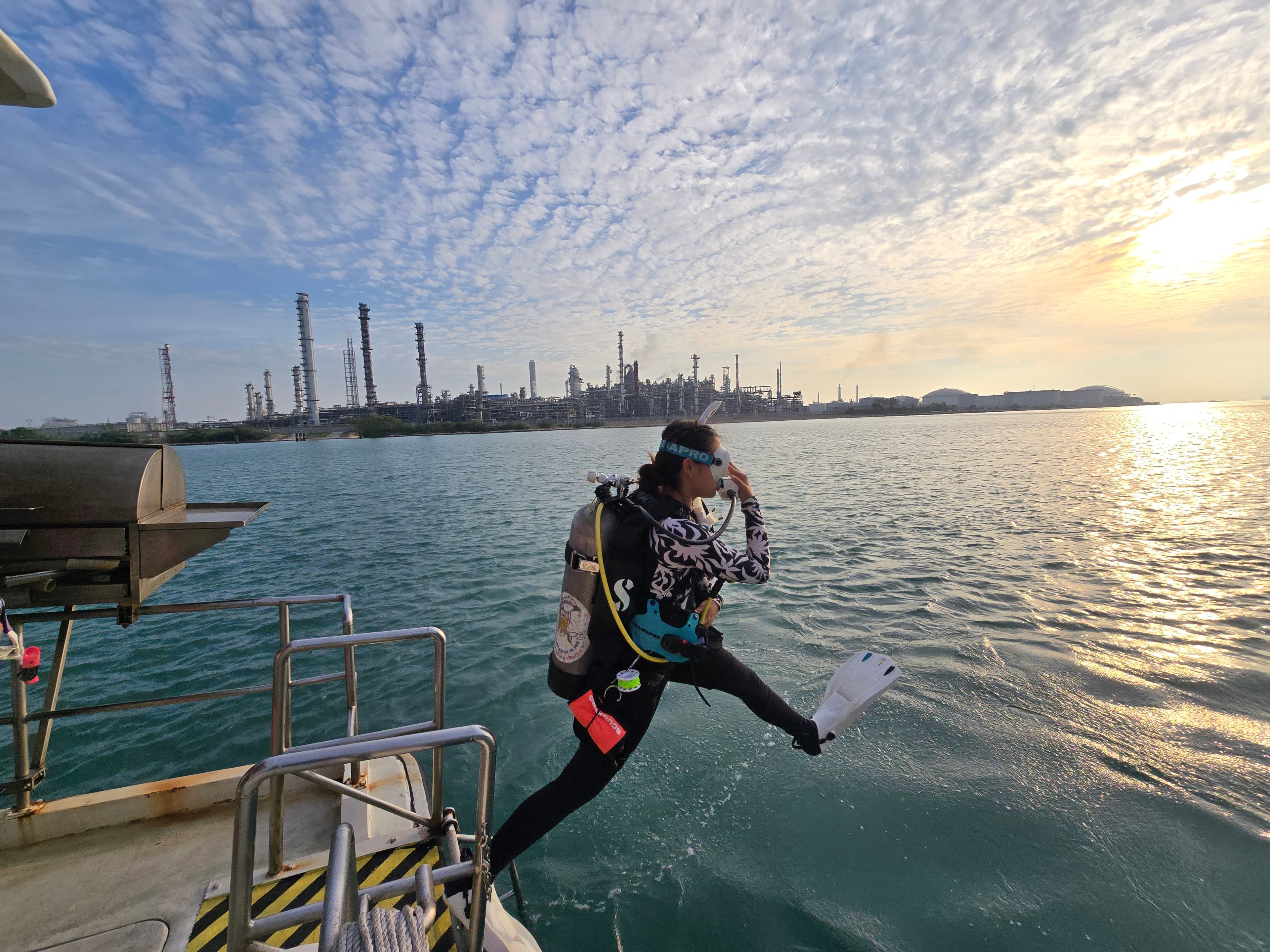 IDC candidate entering the water at sunrise for open water training