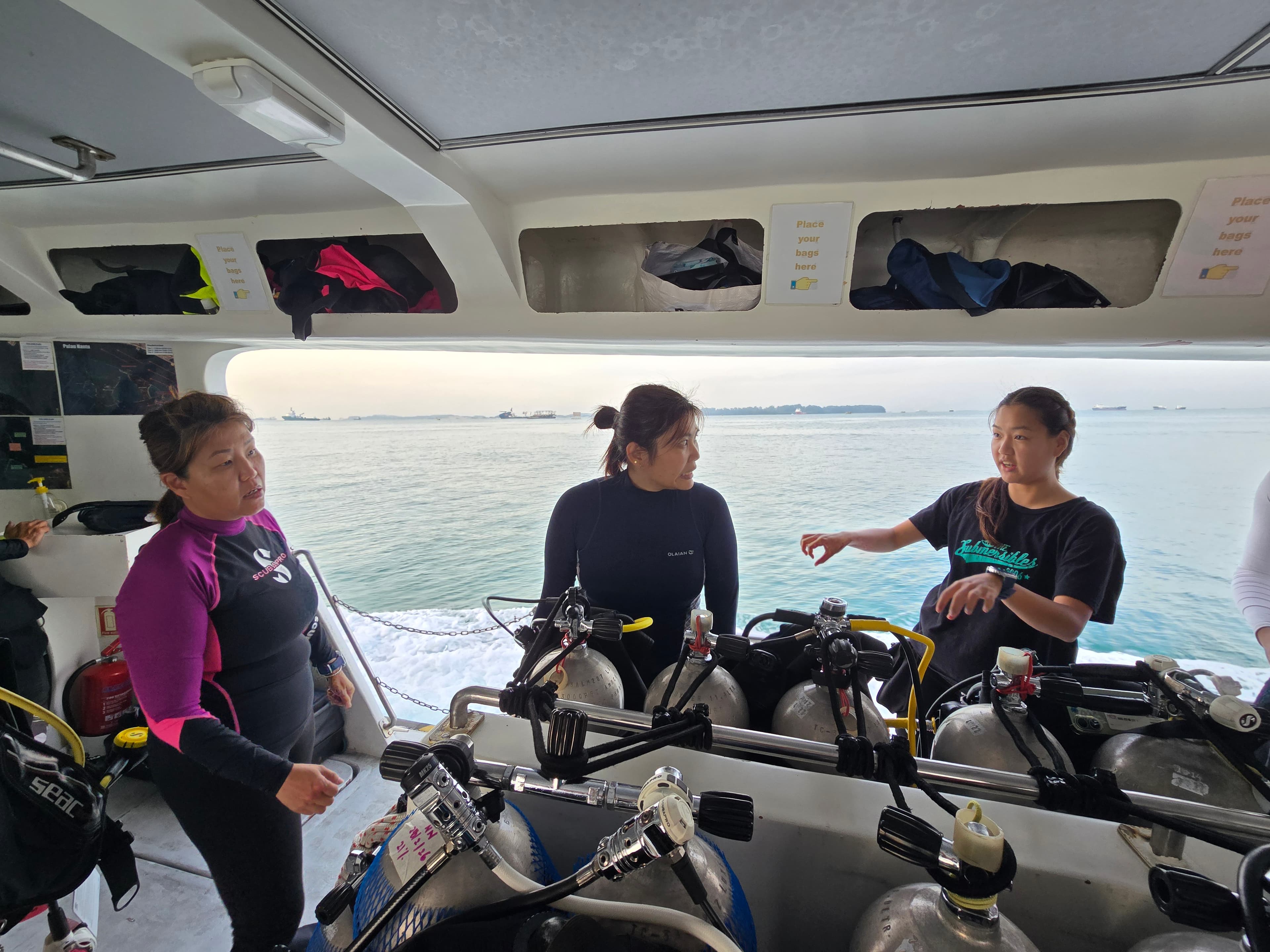 Candidates checking dive equipment before entering the water